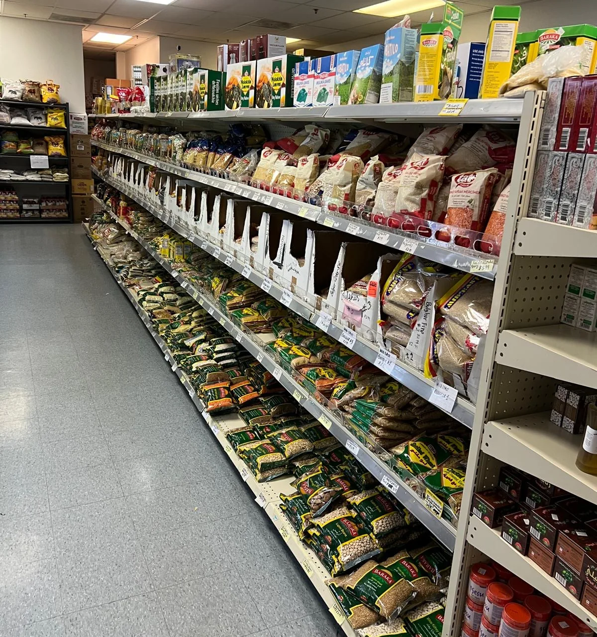 Rice, lentils and other pantry staples on the shelves at Sidra Market