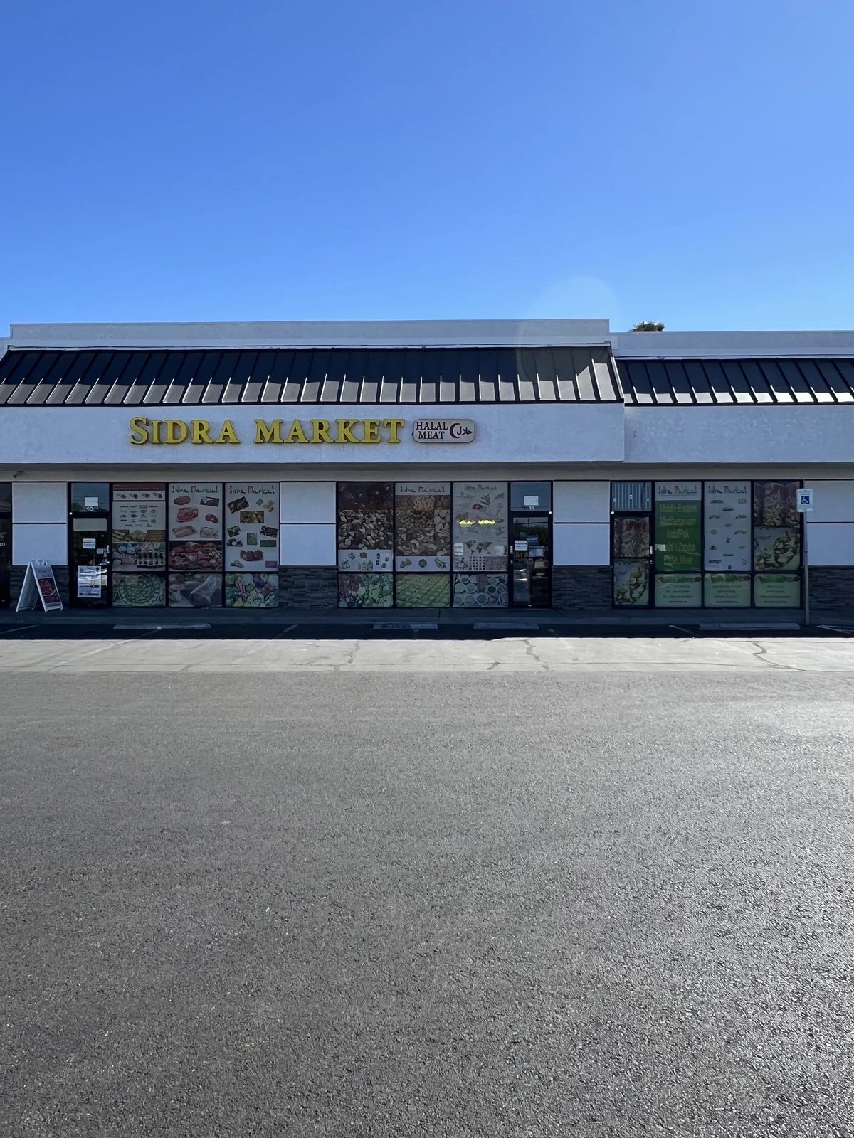 Sidra Market storefront, with its yellow Sidra Market sign and entrance